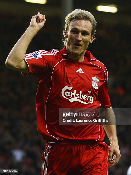 Sami Hyypia of Liverpool celebrates scoring the opening goal during the Barclays Premier League match between Liverpool and Bolton Wanderers at...