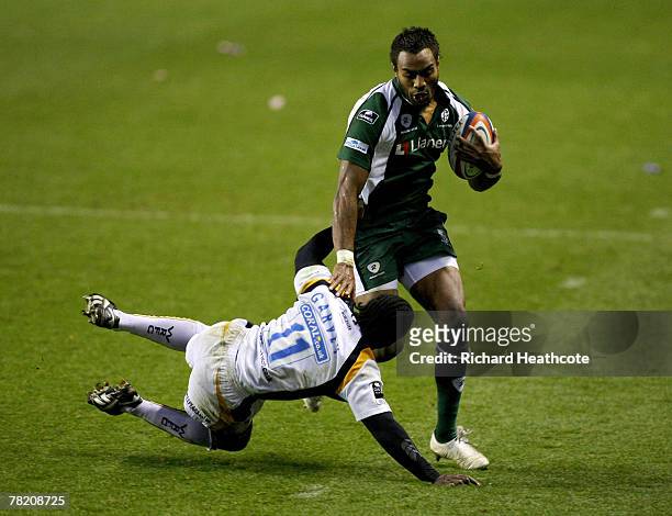 Sailosi Tagicakibau of Irish skips over the challenge of Marcel Garvey of Worcester during the EDF Energy Cup group C match between London Irish and...
