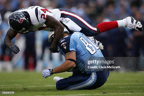 Brown of the Houston Texans tackles Bo Scaife of the Tennessee Titans on December 02, 2007 at LP Field in Nashville, Tennessee.