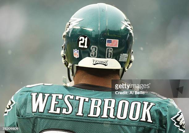 Michael Westbrook of the Philadelphia Eagles wears the number 21 of murdered Washington Redskin Sean Taylor on the back of his helmet during the game...
