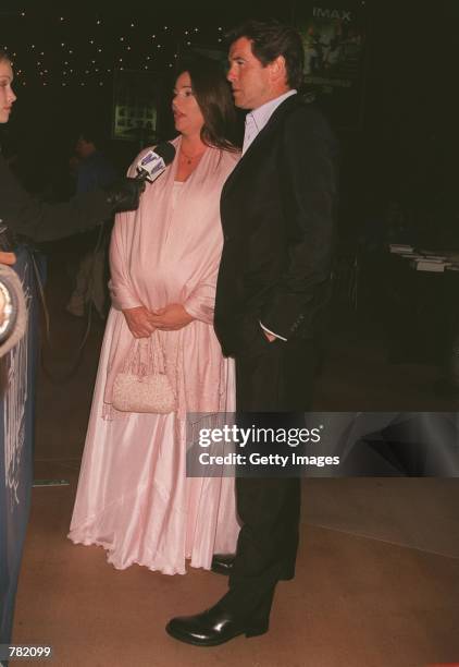 Actor Pierce Brosnan and his fiancee journalist Keely Shaye Smith talk to the press at the premiere of "Why Are We Here?" the Public Awareness...