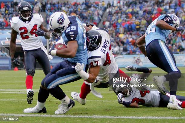 Chris Brown of the Tennessee Titans scores a touchdown under pressure from Will Demps of the Houston Texans on December 02, 2007 at LP Field in...