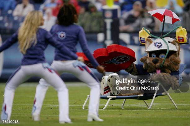 Tennessee Titans mascot T- Rac watches the Titans cheerleaders as they perform during their game against the Houston Texans on December 02, 2007 at...