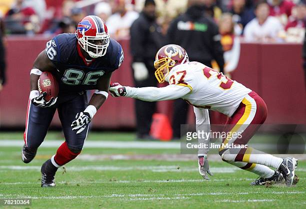 Michael Gaines of the Buffalo Bills runs the ball past Reed Doughty of the Washington Redskins during their game on December 2, 2007 at FedEx Field...