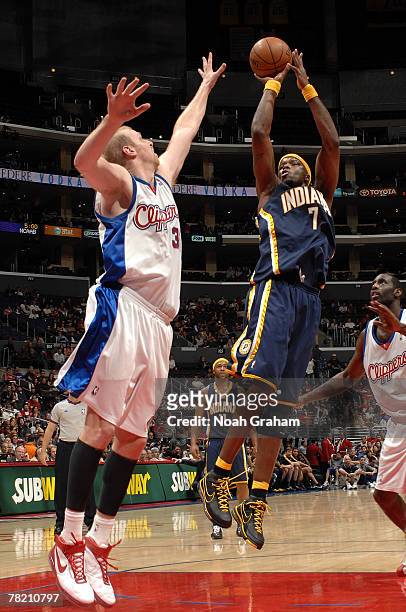 Jemaine O'Neal of the Indiana Pacers shoots over Chris Kaman of the Los Angeles Clippers at Staples Center December 2, 2007 in Los Angeles,...