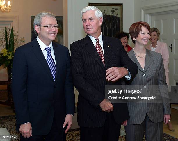 Prime Minister Kevin Rudd, Governor General Michael Jeffrey and Deputy Prime Minister Julia Gillard pose at a swearing in ceremony at Government...