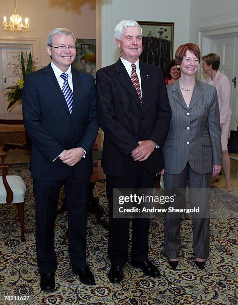 Prime Minister Kevin Rudd, Governor General Michael Jeffrey and Deputy Prime Minister Julia Gillard pose at a swearing in ceremony at Government...