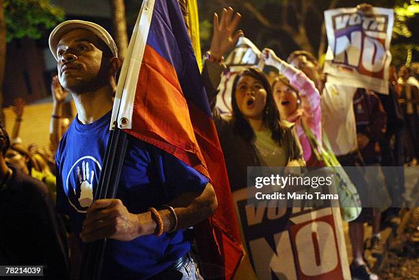 Opposition supporters celebrate after defeating a referendum on changes to the Constitution proposed by Venezuelan President Hugo Chavez December 3,...