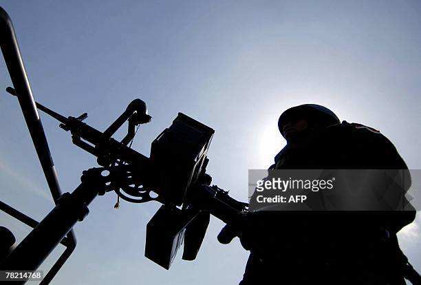 An Indonesian soldier attends a roll call ahead of United Nations conference on global climate change in Denpasar, 30 November 2007. Indonesia is to...