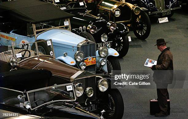 Possible buyer views motor cars for sale at the Bonham's Car Auction on December 3, 2007 in London. The Important Collectors' Motor Car sale is one...