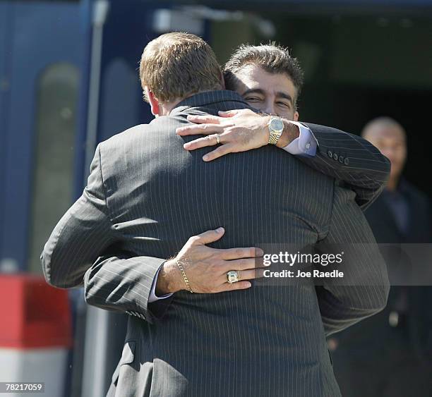 Former University of Miami and current New York Giant football player, Jeremy Shockey, is hugged after arriving for the funeral of Redskins football...