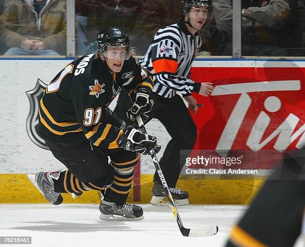 Steve Stamkos of the Sarnia Sting skates up ice with the puck in a game against the London Knights on November 30, 2007 at the John Labatt Centre in...
