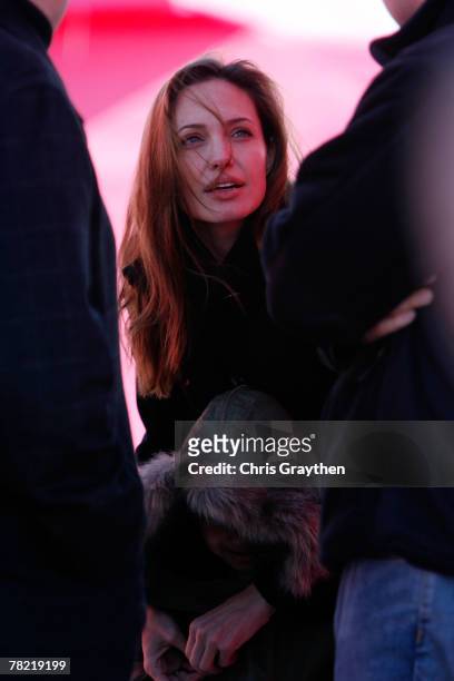 Actress Angelina Jolie and her son Maddox attend a press conference by actor Brad Pitt to unveil the site and design of his "Make It Right" program...