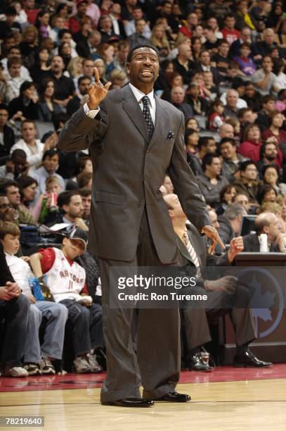 Head coach Sam Mitchell of the Toronto Raptors calls a play from the sideline during the game against the Indiana Pacers at the Air Canada Centre on...