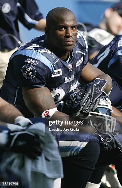 Ricky Williams of the Toronto Argonauts on the sidelines and in action vs the Winnipeg Blue Bombers in a Canadian Football League game at Rogers...