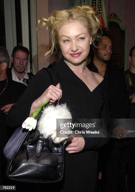 Actress Portia de Rossi and her dog "Bean" arrive at a launch party for the Fifi and Romeo Boutique November 18, 2000 in Los Angeles, CA. Fifi and...