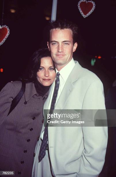 Actor Matthew Perry and television show "Friends" co-star actress Courteney Cox attend the film premiere of "Fools Rush In" February 10, 1997 in...