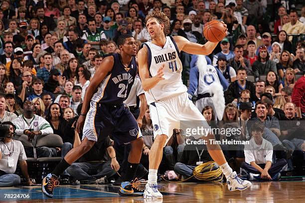 Dirk Nowitzki of the Dallas Mavericks posts up against Rudy Gay of the Memphis Grizzlies during the game at the American Airlines Center on November...