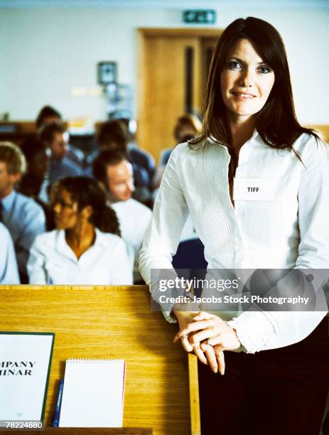 businesswoman at a company seminar - name tag organizer stock pictures, royalty-free photos & images