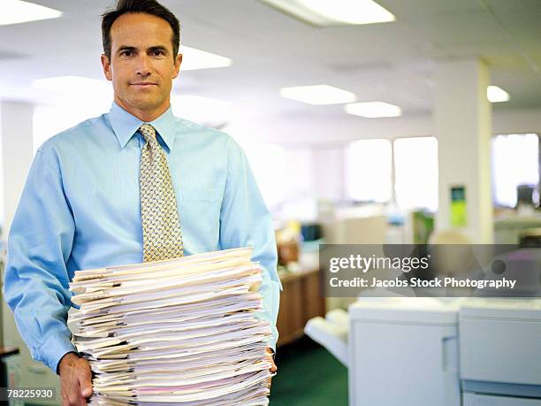 businessman with stack of papers - data entry stock pictures, royalty-free photos & images