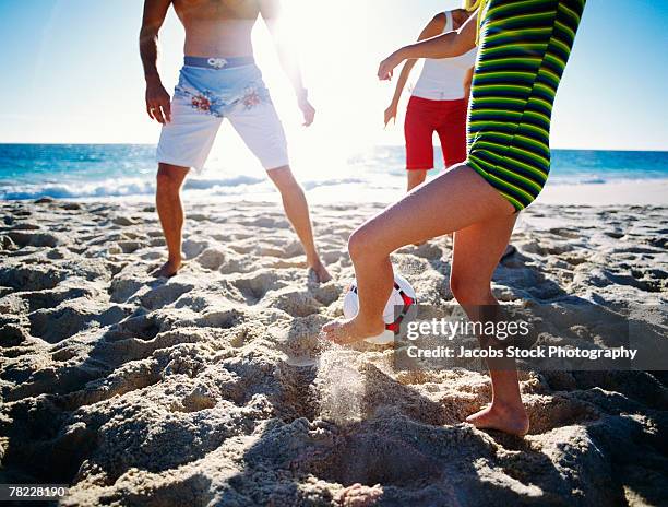 people playing soccer on beach - girl with legs open stock pictures, royalty-free photos & images