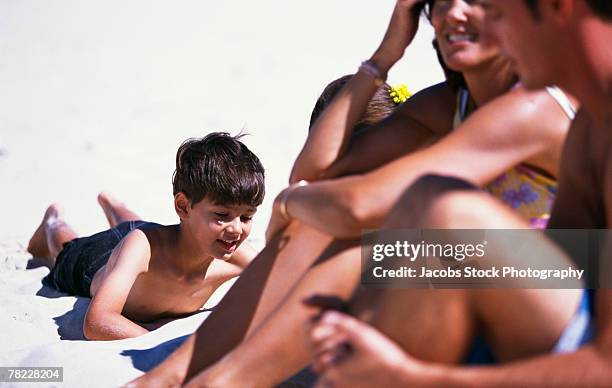 family on beach - girl with legs open stock pictures, royalty-free photos & images