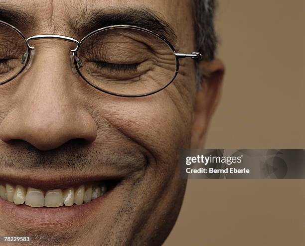 facial detail of smiling mature man - man smiling eyes closed stock pictures, royalty-free photos & images