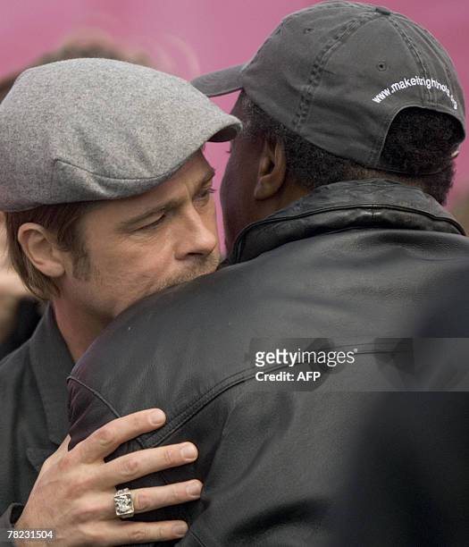 Actor Brad Pitt greets Robert Green during a press conference 03 December 2007 in the Lower 9th Ward of New Orleans, Louisiana on Pitt's plans to...
