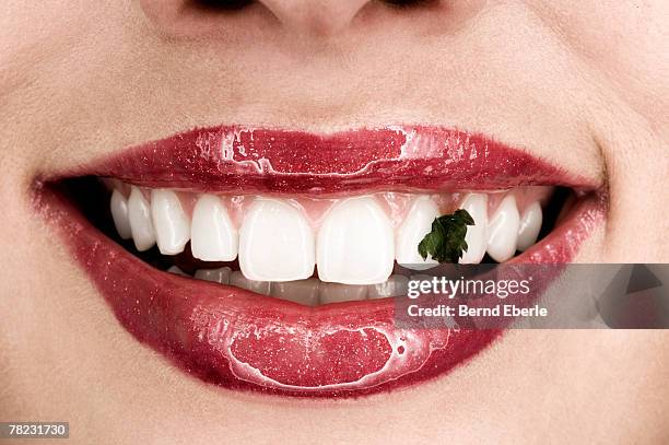 woman showing smile with dirty teeth - toothy smile stock-fotos und bilder