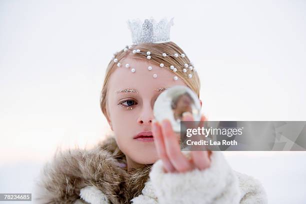 portrait of snow queen holding crystal ball - frozen princess stock pictures, royalty-free photos & images