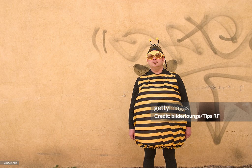 Man wearing bee costume