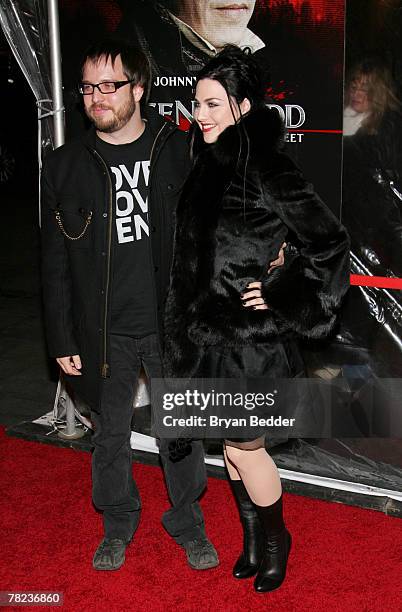 Singer Amy Lee and husband Josh Hartzler attend the New York premiere of "Sweeney Todd The Demon Barber Of Fleet Street" at the Ziegfeld Theater on...