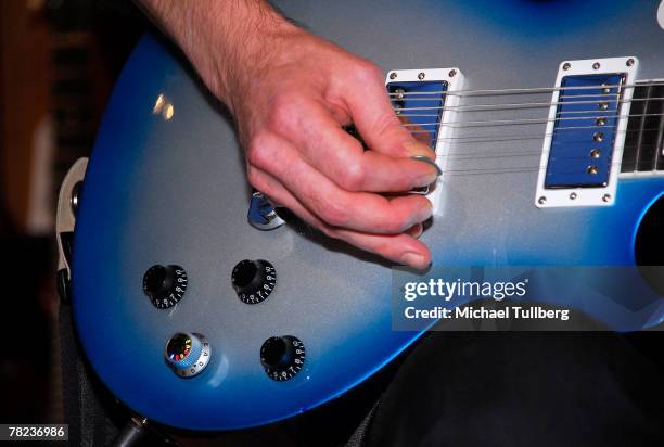 Musician Johnny Rzeznik of the rock group the Goo Goo Dools demonstrates the new self-tuning, limited edition Gibson Robot Guitar at the Guitar...