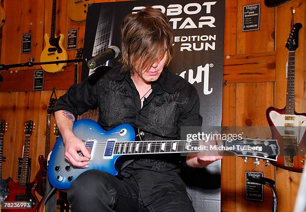 Musician Johnny Rzeznik of the rock group the Goo Goo Dools demonstrates the new self-tuning, limited edition Gibson Robot Guitar at the Guitar...