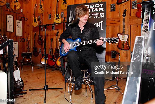 Musician Johnny Rzeznik of the rock group the Goo Goo Dools demonstrates the new self-tuning, limited edition Gibson Robot Guitar at the Guitar...