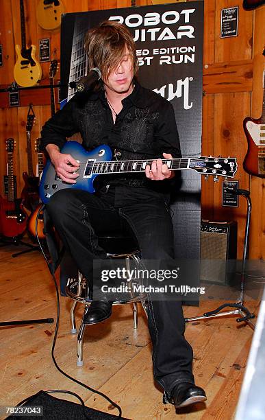 Musician Johnny Rzeznik of the rock group the Goo Goo Dools demonstrates the new self-tuning, limited edition Gibson Robot Guitar at the Guitar...