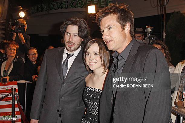 Actress Ellen Page poses with co-star Jason Bateman and director Jason Reitman as they arrive on the red carpet for the premiere of "Juno" at the...
