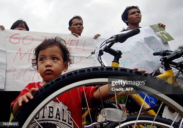 Indonesia's mud-volcano victims take part in a demonstration near the venue of the UN Climate Change Conference 2007 in Nusa Dua, on Bali island, 04...