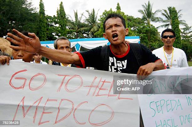 Indonesia's mud-volcano victims shout slogans during a demonstration near the venue of the UN Climate Change Conference 2007 in Nusa Dua, on Bali...