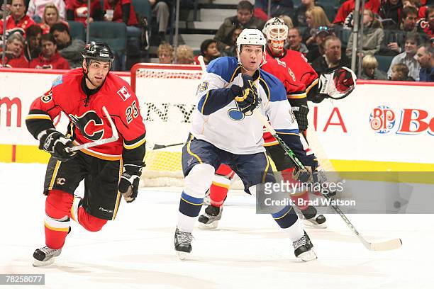 Eric Nystrom of the Calgary Flames skates against Dan Hinote of the St. Louis Blues on December 4, 2007 at Pengrowth Saddledome in Calgary, Alberta,...