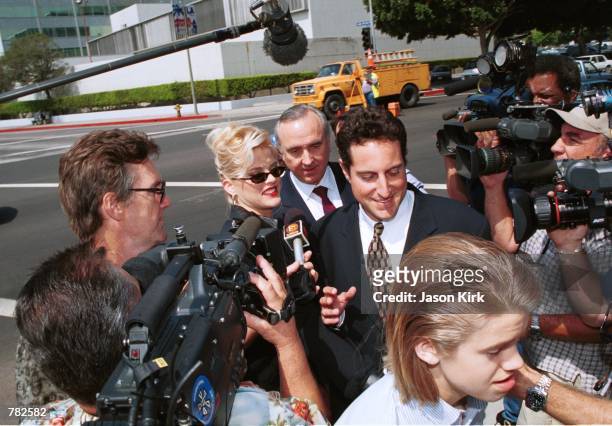 Model Anna Nicole Smith with her son Daniel walk through the crowd outside the Los Angeles courthouse July 25, 2000 in Los Angeles, CA. On September...