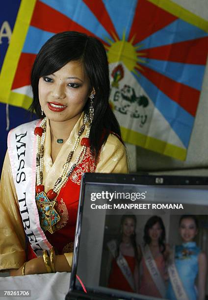 Miss Tibet 2006 Tsering Chungtak answers a question during a press conference in New Delhi, 05 December 2007. A Tibetan contestant barred from...