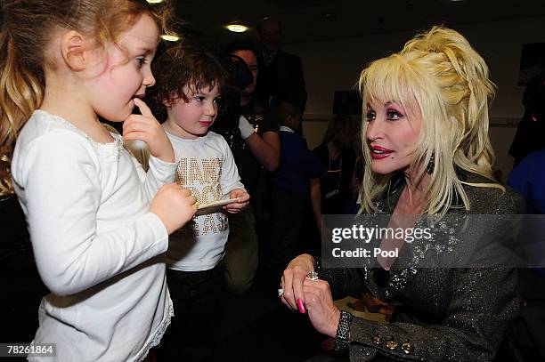 Country and western superstar singer Dolly Parton meets young children at the Magna Science And Adventure Park on December 5, 2007 in Rotherham,...