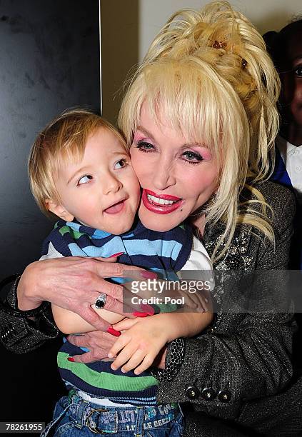Country and western superstar singer Dolly Parton meets young children at the Magna Science And Adventure Park on December 5, 2007 in Rotherham,...