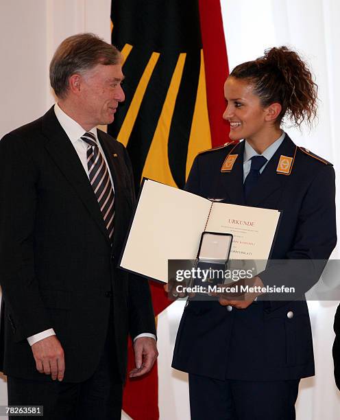 German President Horst Koehler hands over the Silver Laurel Leaf to Fatmire Bajramaj, member of the Womens German National football team, at Bellevue...