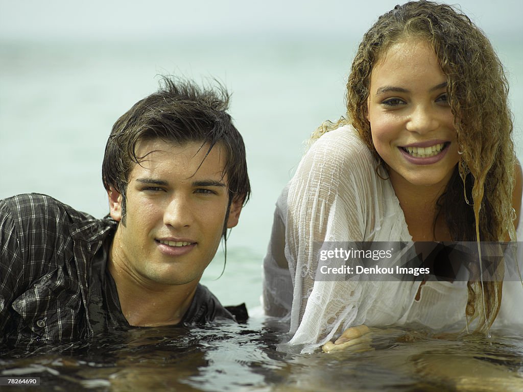 Portrait of a young couple in water