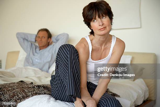 a couple in the bedroom - short hair women stock pictures, royalty-free photos & images