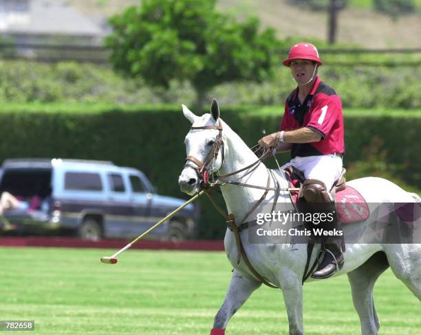 Actor Tommy Lee Jones sits astride his mount as he competes with his San Saba polo team at the Santa Barbara Polo & Racquet Club July 30, 2000 in...