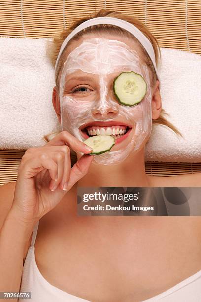 a young woman with a face pack. - eating human flesh stock pictures, royalty-free photos & images