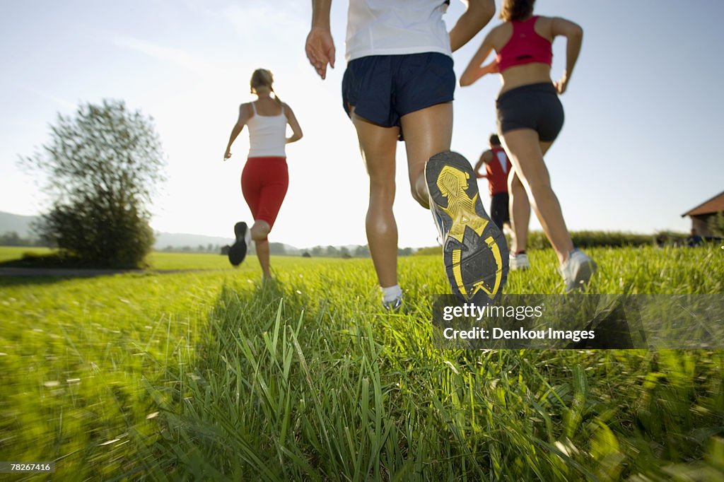 Men and women jogging.